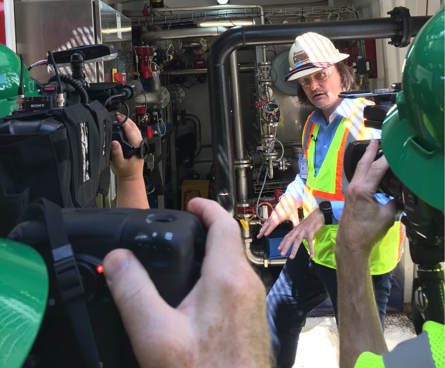Reporters on a marine vessel tour